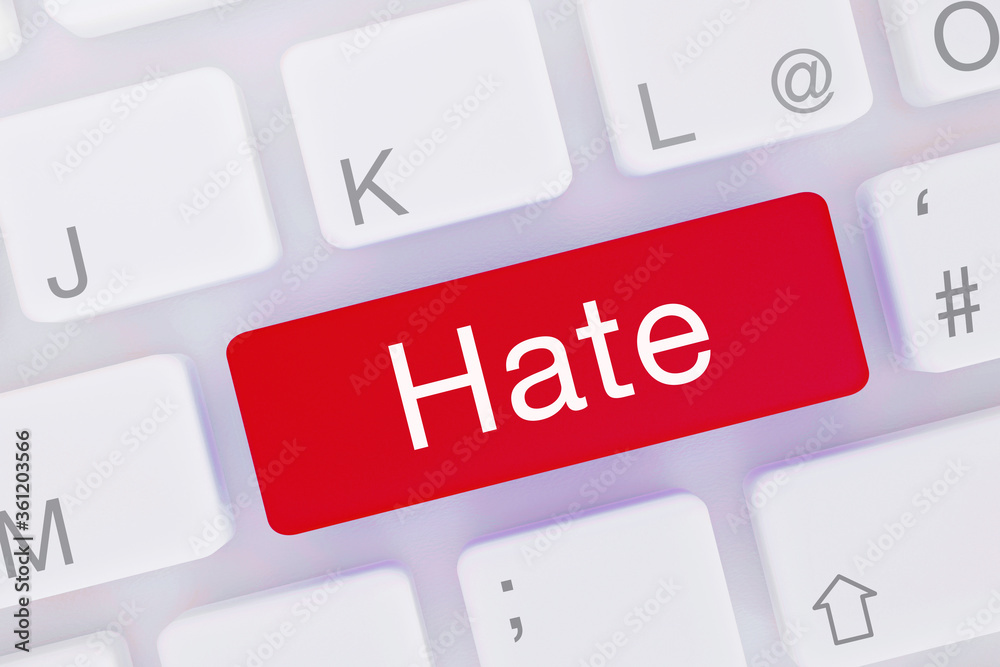 Fototapeta premium Hate. Computer keyboard from above showing key with word highlighted blue. Software, internet, program