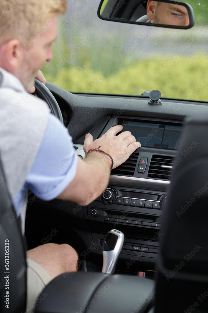 man driving car with navigation system