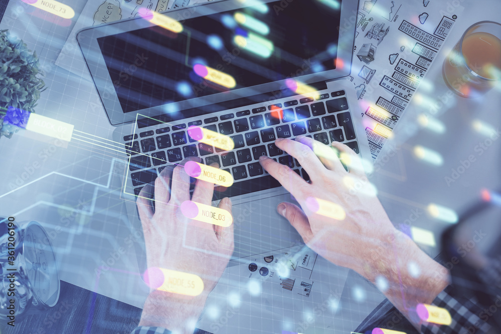 Double exposure of man's hands typing over computer keyboard and data theme hologram drawing. Top view. Technology concept. Double exposure of man's hands typing over computer keyboard and data theme hologram drawing. Top view. Technology concept.