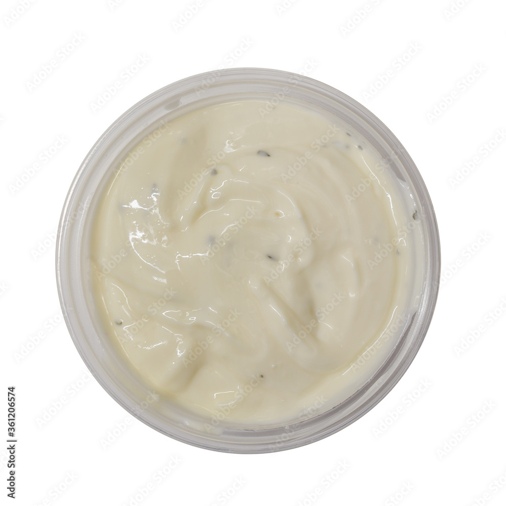 Garlic mayonnaise dip sauce in plastic tub isolated on white background. Top view Garlic mayonnaise dip sauce in plastic tub isolated on white background. Top view