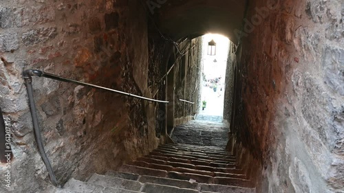 Portovenere, Liguria, Italy. June 2020. In the historic center, a stone tunneled staircase between the houses leading to the lower part of the village. It is called carruggio. photo