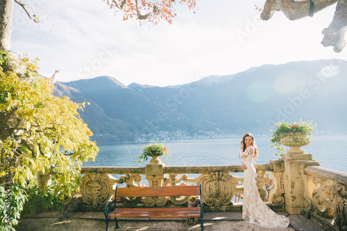 Wedding Bride with veil and white wedding dress on villa Balbianello lake Como in Italy