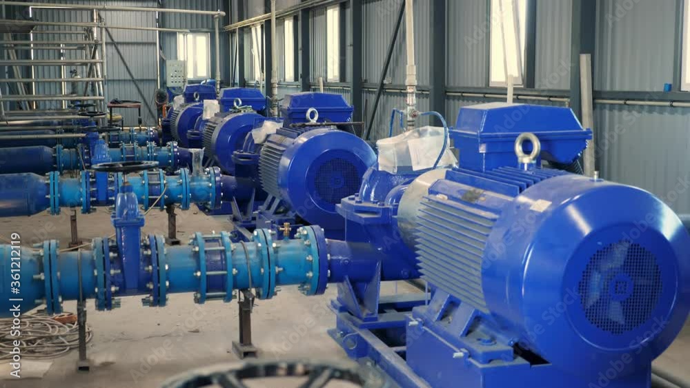 equipment at the electric pumping station. Pumps deliver water to the irrigation tank from a nearby flowing river. modern technologies in irrigation of farm fields