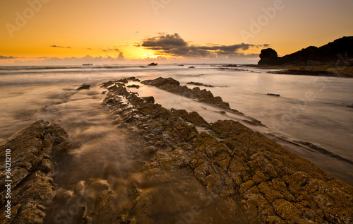 A landscape view of Broad Haven beach at dusk and sunset in Broad Haven, Pembrokeshire, Wales, UK. Taken in July 2014 photo