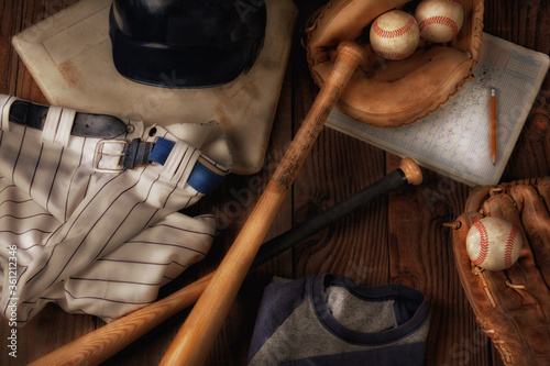 Flat Lay Baseball Still Life with warm sde light. Overhead view of baseball gear on a rustic wood surface. photo