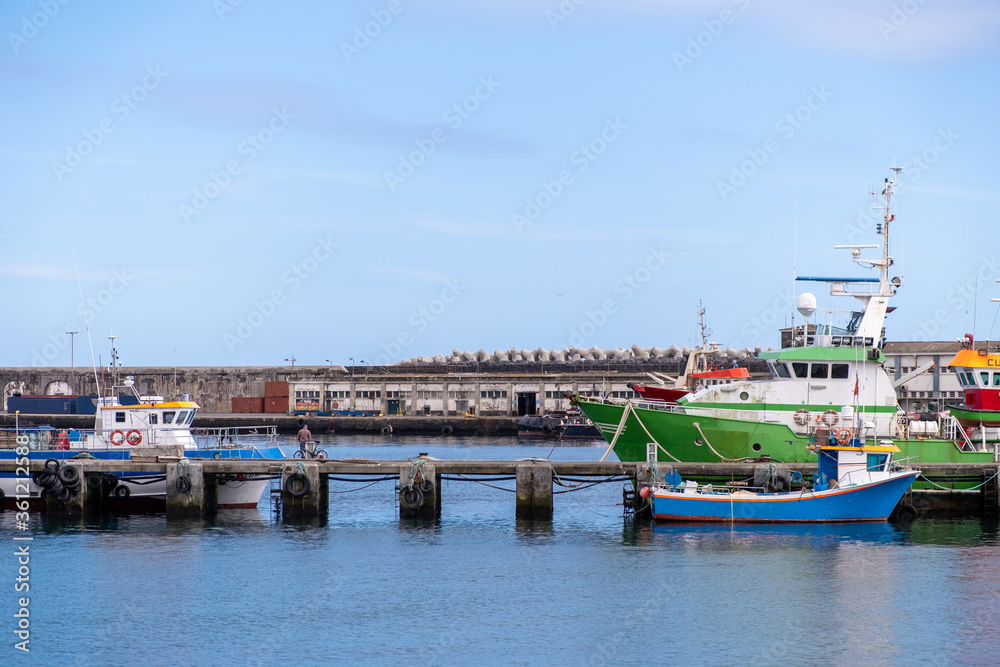 Ships, boats and boats in the port of Ponta Delgada (Porto de Ponta Delgada) in the area of the old Portuguese fort of St. Blasius. Island of São Miguel