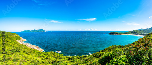 China Guangdong Shenzhen Dapeng Peninsula Dongchong coastline summer blue sky and white clouds scenery © hu