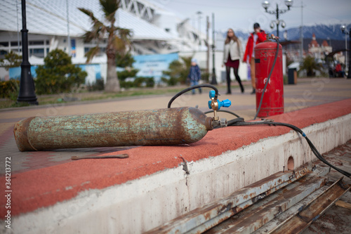 Welding cylinder with gas. Repair work on the street.