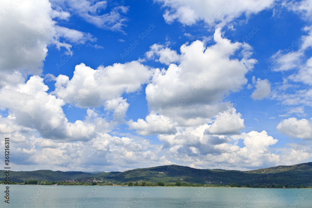 Lake Trasimeno in Umbria, Italy. Blue sky with clouds