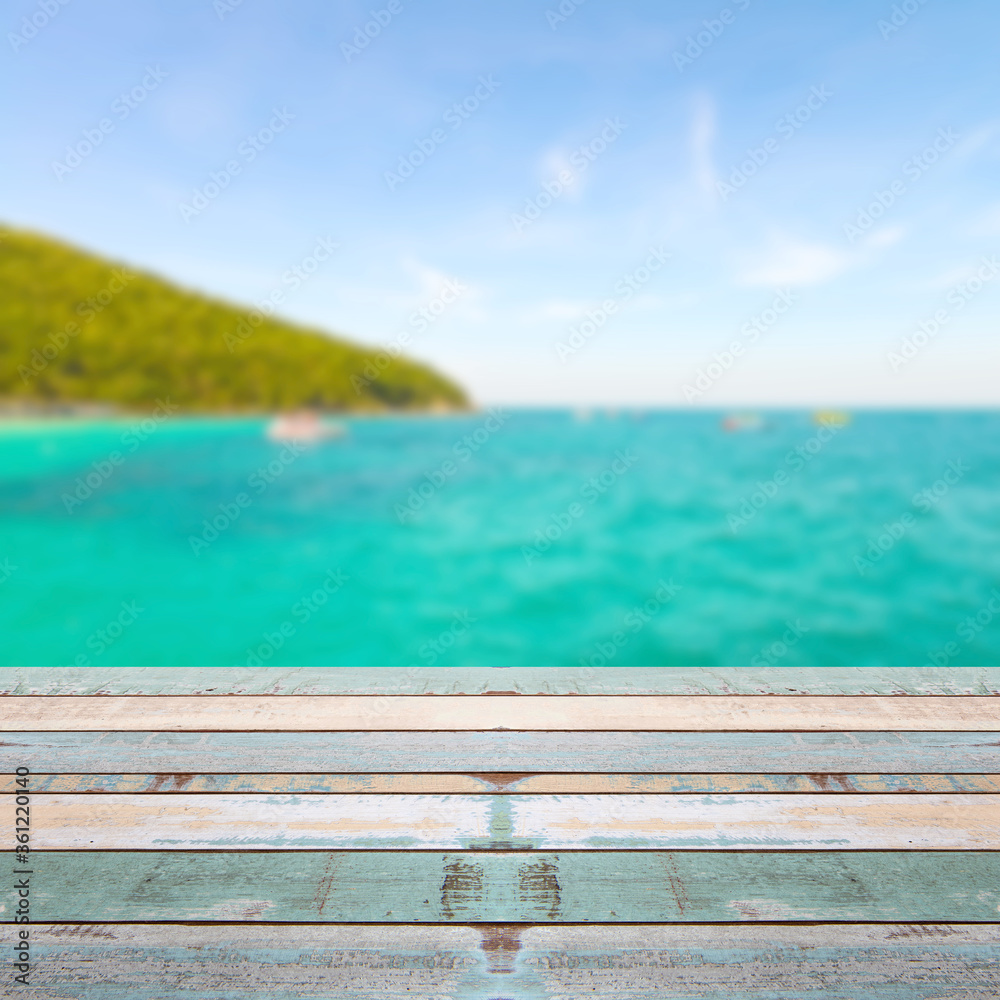 Wood table top with blurred nature scene tropical beach Wood table top with blurred nature scene tropical beach