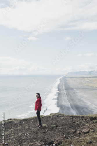 Hiking nature amazing landscape travel wanderlust woman hiker on holiday in Iceland. Panoramic banner hero view of icelandic lake. © ALEXSTUDIO