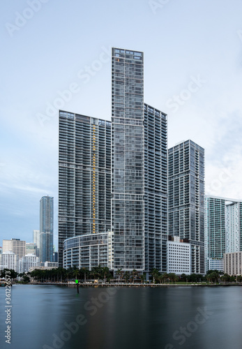 Miami  FL USA - 06 20 2020  Icon Brickell luxury apartment towers during cloudy sunrise.