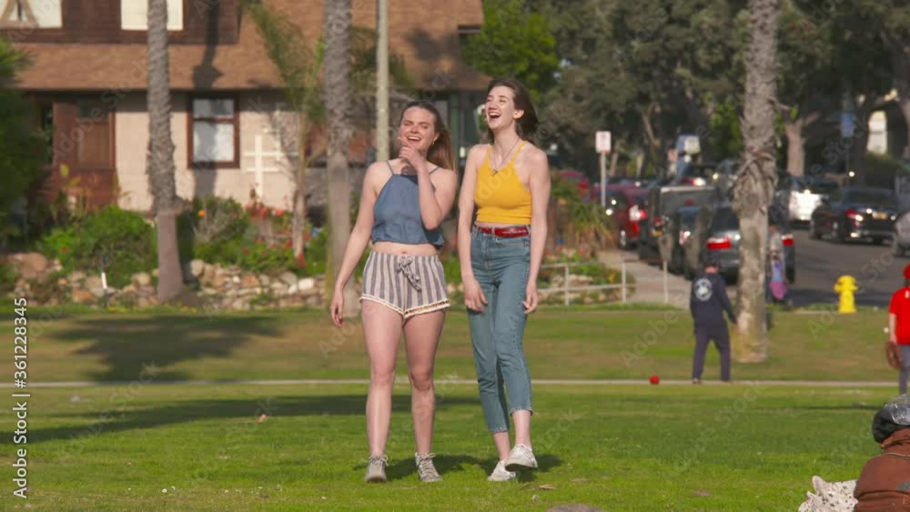 two young women enjoy casual lifestyle at the beach park two young women enjoy casual lifestyle at the beach park
