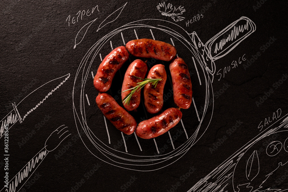 Roasted sausage on black chalkboard with painted pan and ingredients. top view. Barbecue concept. - obrazy, fototapety, plakaty 