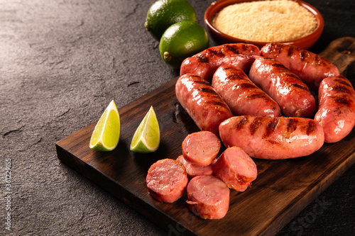 Fresh grilled Pepperoni sausage. Grilled Pepperoni Sausage on wooden board. 