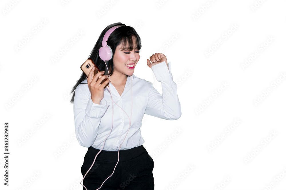 Businesswoman enjoying music with a cellphone Businesswoman enjoying music with a cellphone