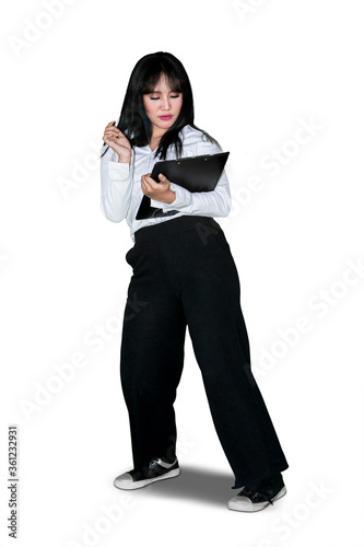 Businesswoman holds business report while dancing