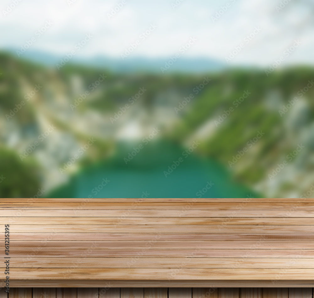 Wood table top on a blur nature background. Wood table top on a blur nature background.