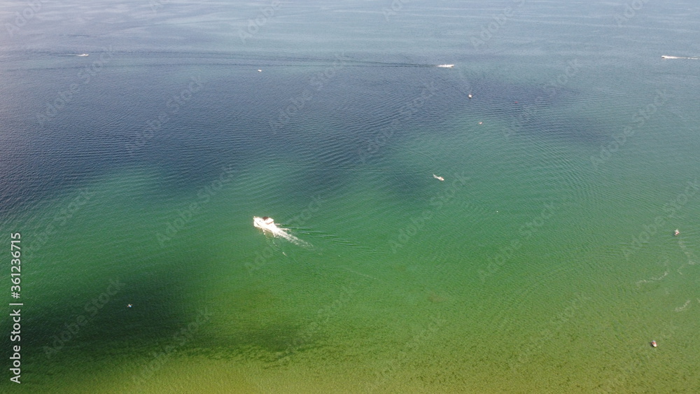 Aerial Image of a Boat Cruising Through Water Aerial Image of a Boat Cruising Through Water