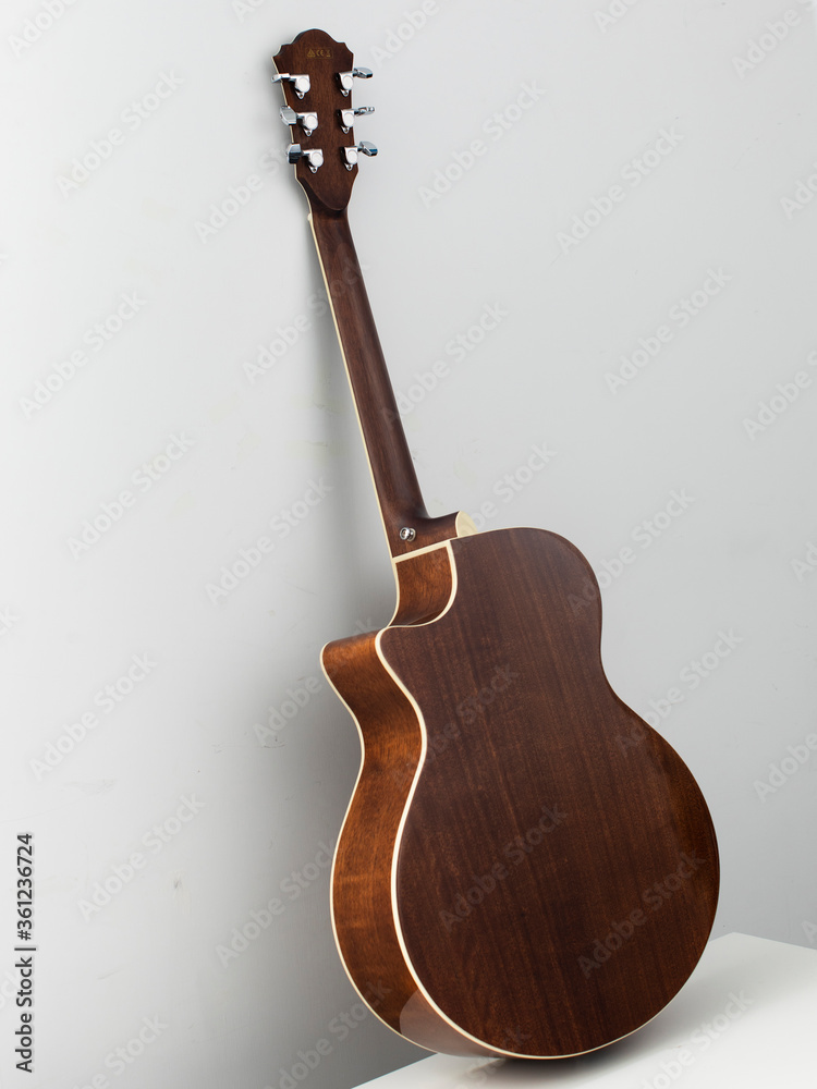Naklejka premium acoustic guitar back on white background