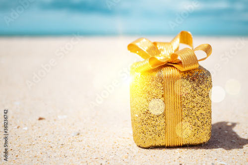 Canvas Print Gift boxes on sandy beach