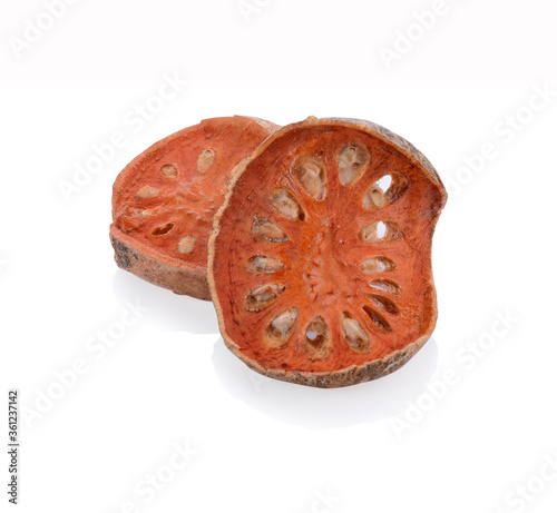 Dried bael fruit isolated on white background.With clipping path. photo