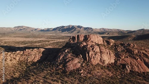 4K aerial drone video of African savanna hills, large red granite boulders range near B1 highway south of Windhoek in central highland Khomas Hochland of Namibia, southern Africa
