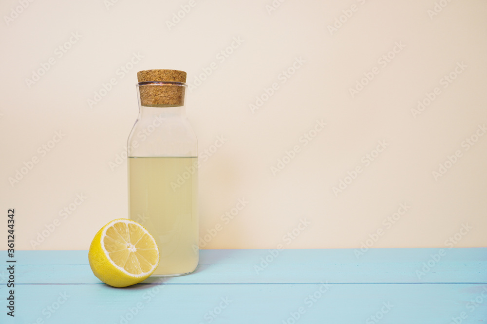 Lemonade or mojito cocktail with lemon and mint, cold refreshing drink or beverage with ice. Copy space for your text