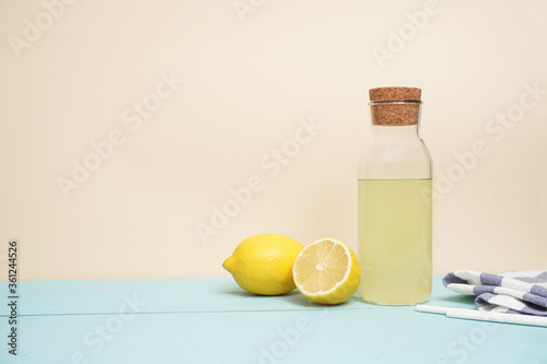 Lemonade or mojito cocktail with lemon and mint, cold refreshing drink or beverage with ice. Copy space for your text