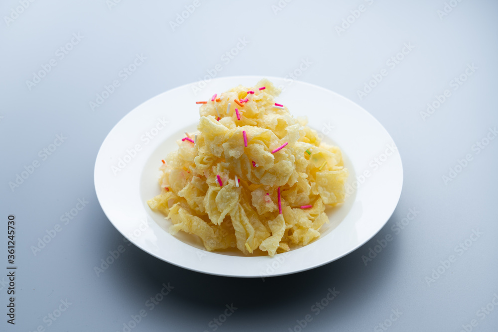 Chinese traditional Beijing snack with pastry fried with ginger juice and sugar. Old Beijing ginger sauce fork. Old Beijing snack fork. Chinese traditional Beijing snack with pastry fried with ginger juice and sugar. Old Beijing ginger sauce fork. Old Beijing snack fork.
