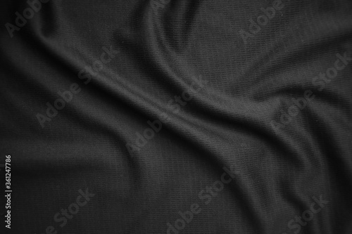 Background texture black cloth. Abstract dark wavy soft. Fabric is wrinkled. Fashion luxury style.