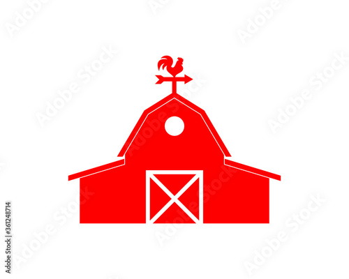 Red barn with a rooster on top