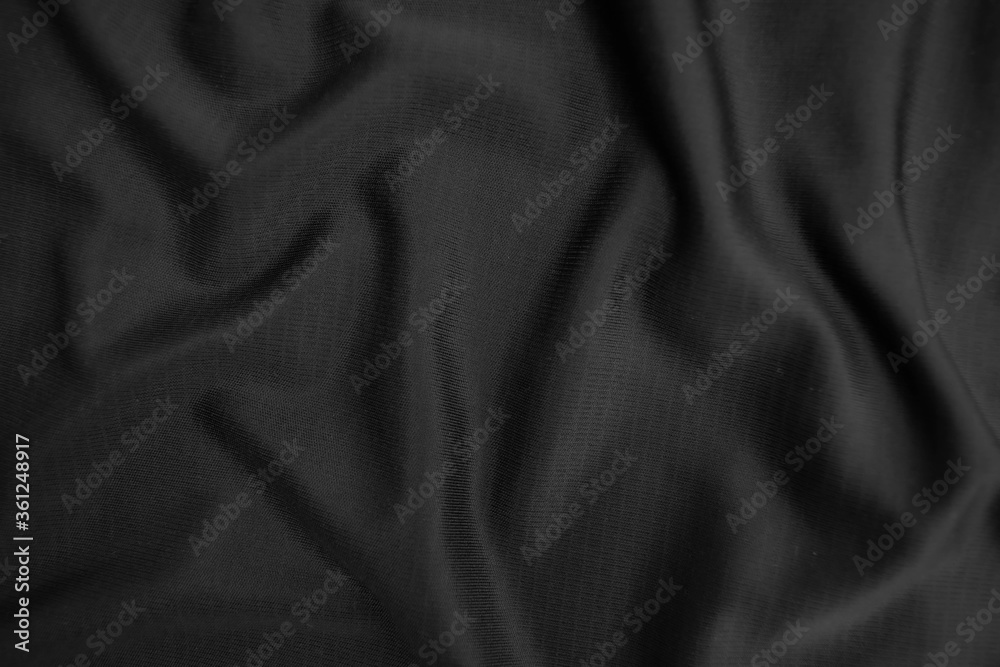Background texture black cloth. Abstract dark wavy soft. Fabric is wrinkled. Fashion luxury style. Background texture black cloth. Abstract dark wavy soft. Fabric is wrinkled. Fashion luxury style.