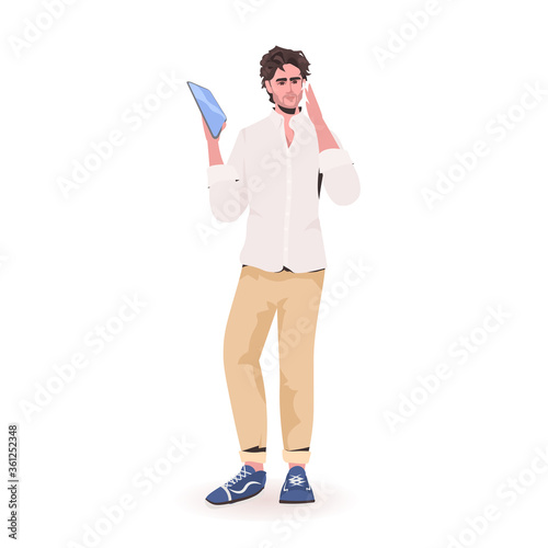 man holding tablet pc young guy model in trendy clothes male cartoon character standing pose full length isolated vector illustration