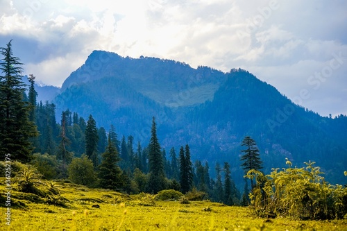 Landscape view of the fields and Manali mountains in India photo