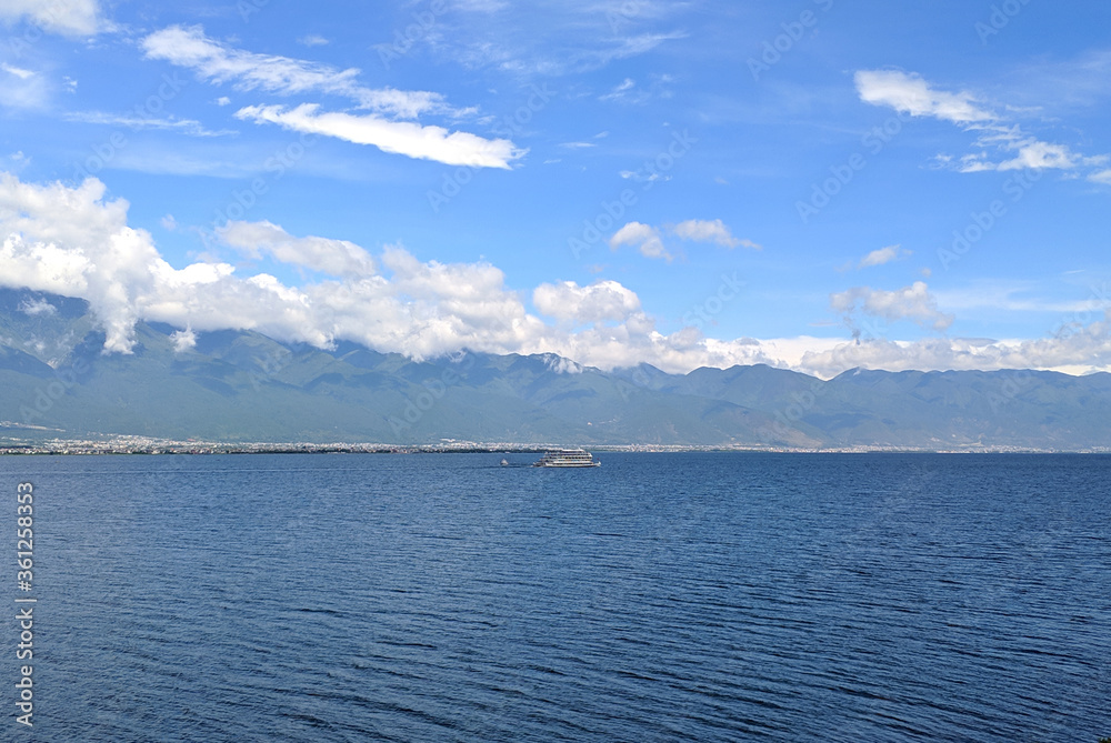 landscape of blue lake and blue sky with white clouds landscape of blue lake and blue sky with white clouds
