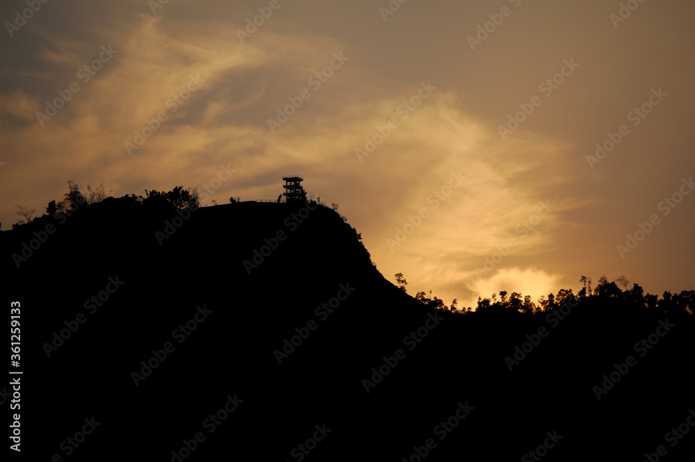 silhouette of a mountain at sunset