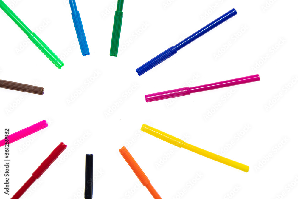 Colored felt-tip pens on a white background.