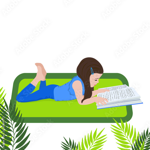 Little girl reads a book and is lying. Distance learning. Home education. School girl girl doing homework. Child with a book in her hands. Bookcrossing.