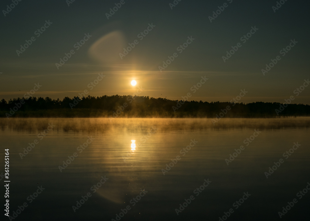 Foggy weather early in the morning on the lake. beautiful wallpapers. a mystical mist vibrates in the lake. summer sunrise Foggy weather early in the morning on the lake. beautiful wallpapers. a mystical mist vibrates in the lake. summer sunrise