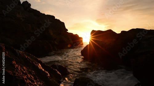 Sunrise between the rocks of the renega in Oropesa photo