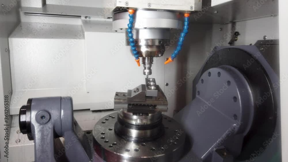 Precision milling CNC machine tool makes part.