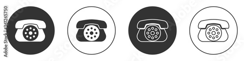 Black Telephone icon isolated on white background. Landline phone. Circle button. Vector Illustration.