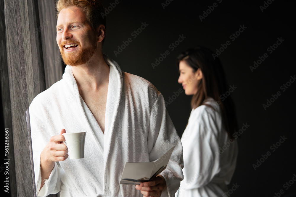 Male in bathrobe relaxing while drinking tea Male in bathrobe relaxing while drinking tea