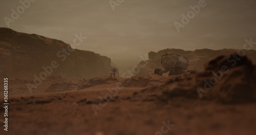 Tableau sur toile Astronaut walking near planet rover vehicle on a surface of a red rocky planet