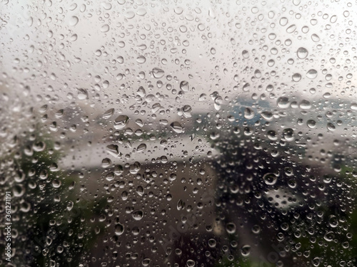 Close up rain drops on  plastic background.Water drops on window glass.