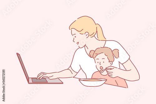 Business, quarantine, coronavirus, motherhood, childhood concept. Busy young mom freelancer working home with laptop feeding hungry child kid daughter. Work on lockdown and stay at home or mothers day