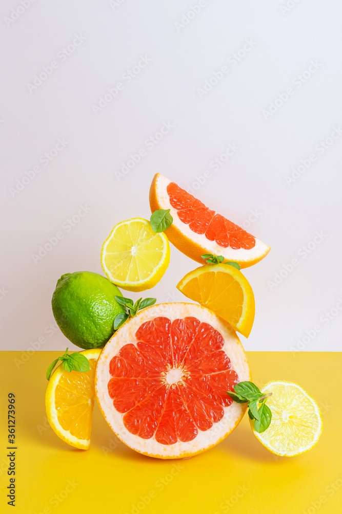 Creative bright composition of orange, grapefruit, lime and lemon. The concept of citrus, summer, vitamin healthy food, vegetarianism. Creative bright composition of orange, grapefruit, lime and lemon. The concept of citrus, summer, vitamin healthy food, vegetarianism.