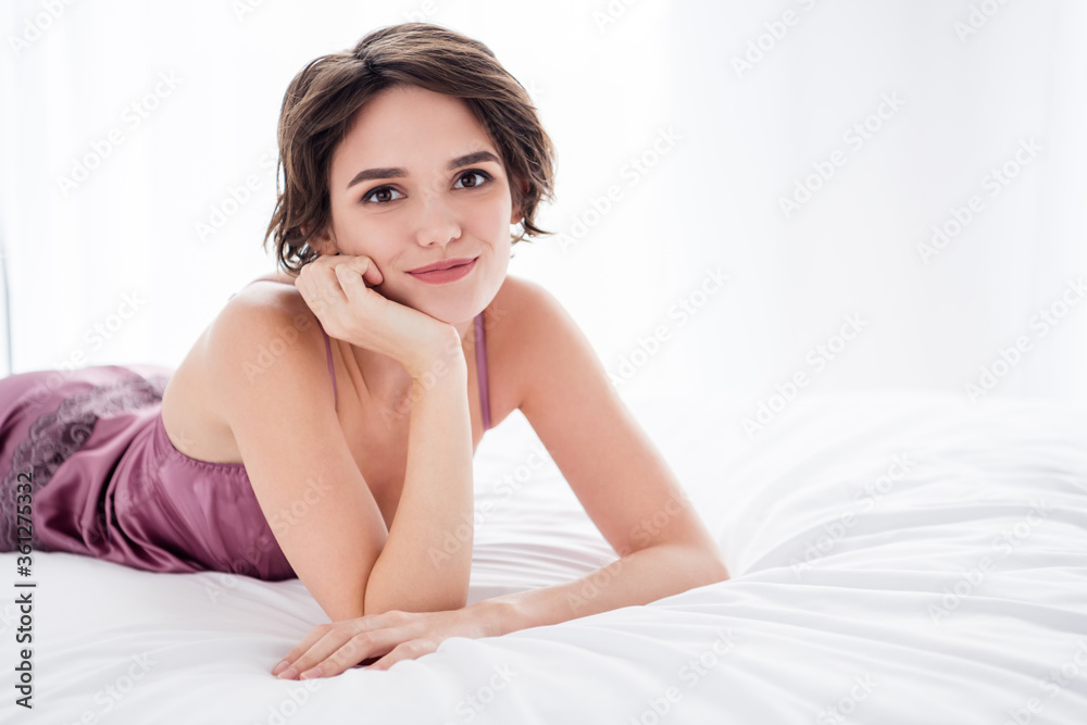 Close-up portrait of her she nice attractive charming pretty cute cheery sweet brown-haired girl wearing silk resting lying on bed waiting boyfriend in light white style interior house apartment flat Close-up portrait of her she nice attractive charming pretty cute cheery sweet brown-haired girl wearing silk resting lying on bed waiting boyfriend in light white style interior house apartment flat