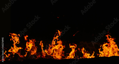 Fire flames isolated on black background. Copy space. 